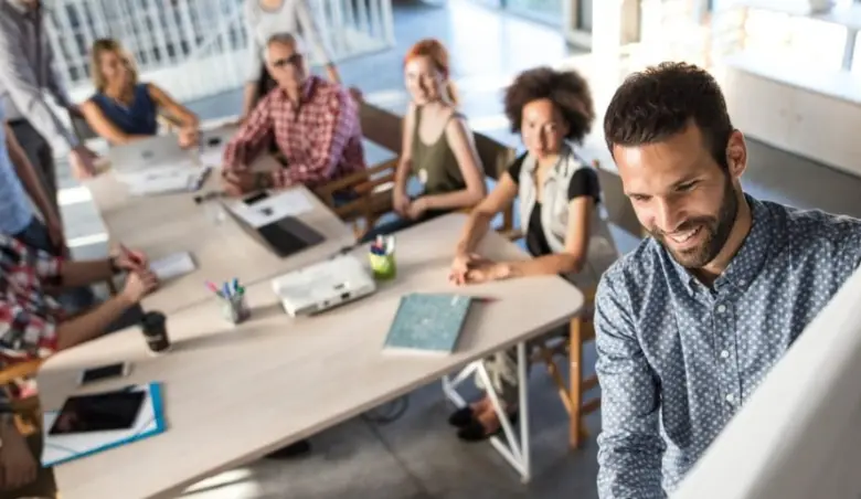 Above view of happy entrepreneur explaining the business plan to his picture id941265460 1