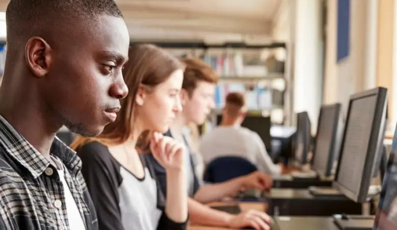 Group of students using computers in college library picture id879041304