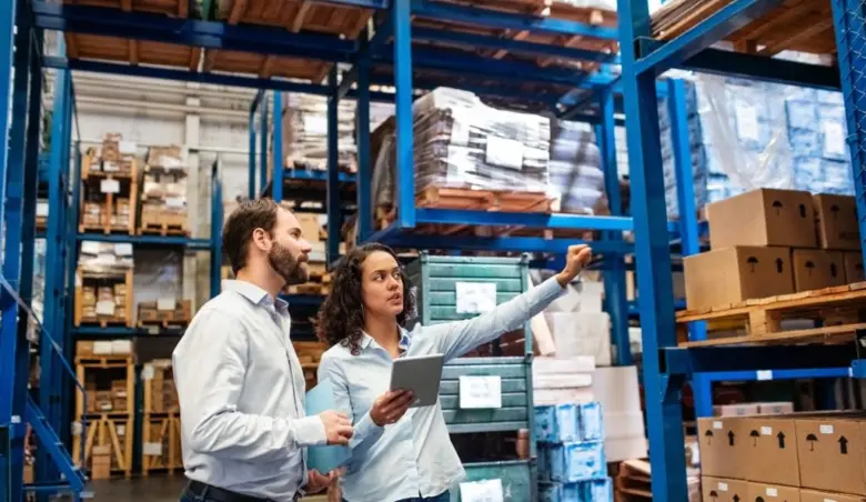 Manager and supervisor taking inventory in warehouse picture id1210182387
