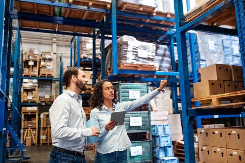 Manager and supervisor taking inventory in warehouse picture id1210182387